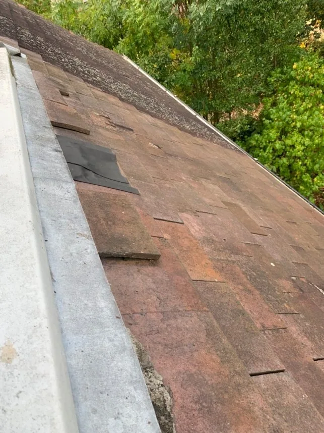 Handmade clay tiles re-laid over wood-fibre sarking insulation at Church Way, Iffley