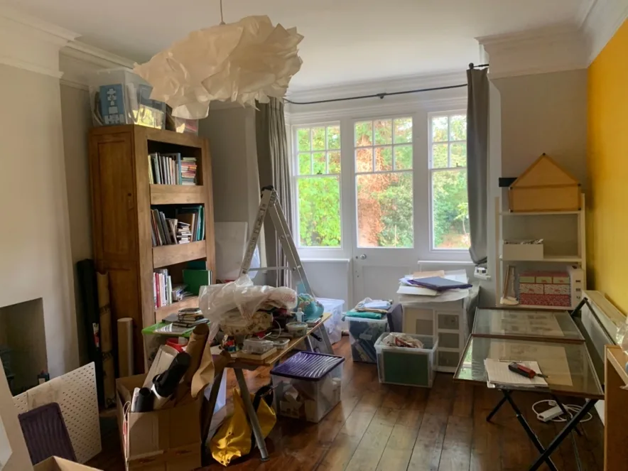 Original single-glazed timber sash windows in a first-floor room before replacement