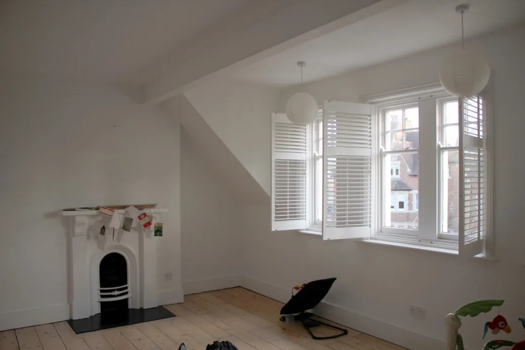 The room-in-the-roof with sloping skeilings, dormer bay and fireplace
