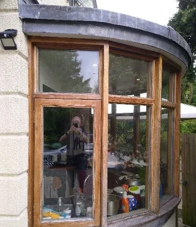Curved oak-framed turret glazing from the 2000 extension